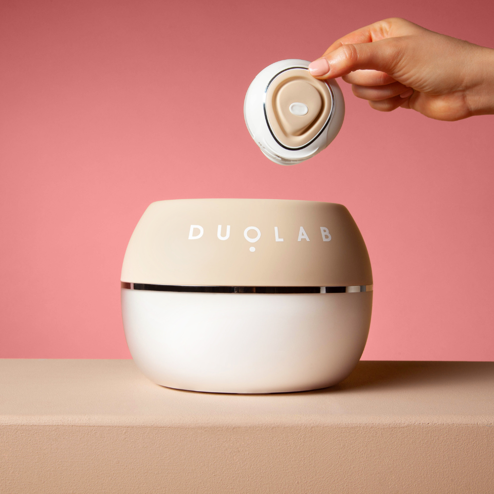 Someone placing the applicator into the Duolab device