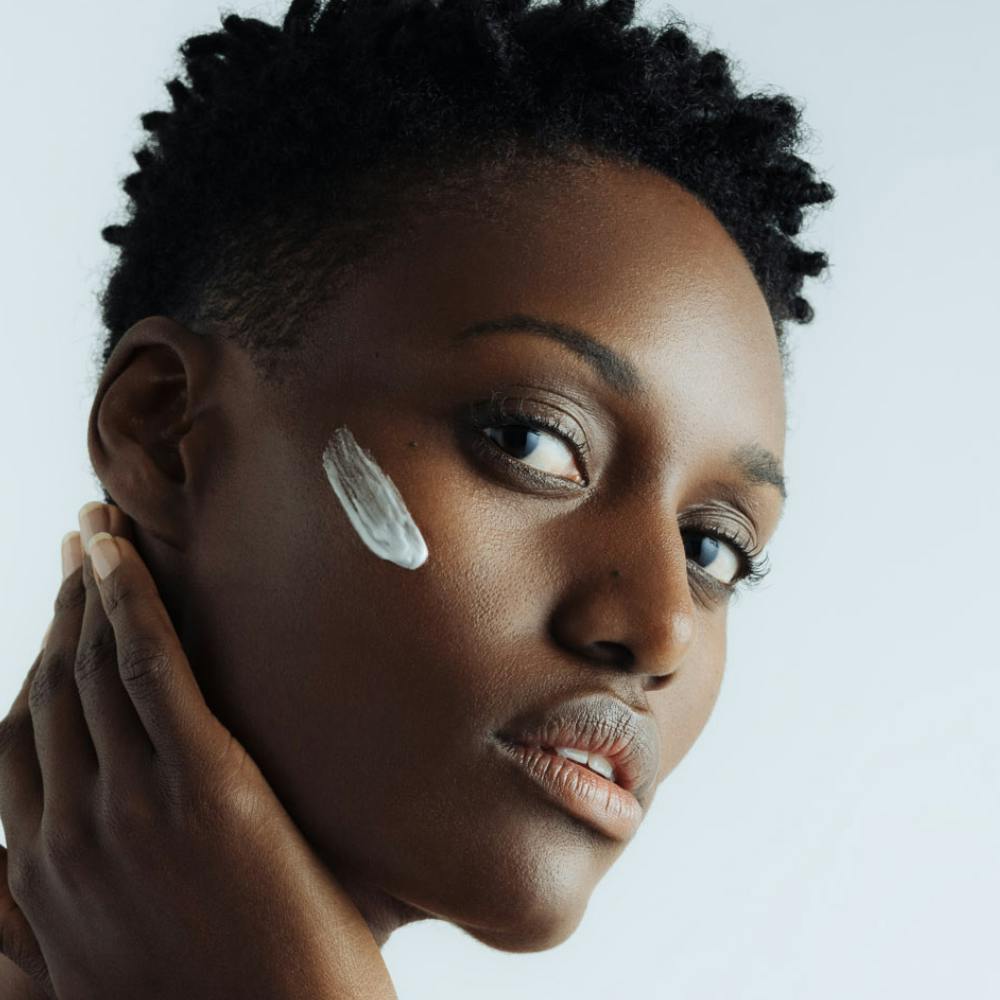 Woman with moisturizer on her face