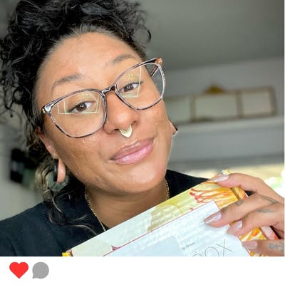 A woman with LimeLife's AMAZEBOX